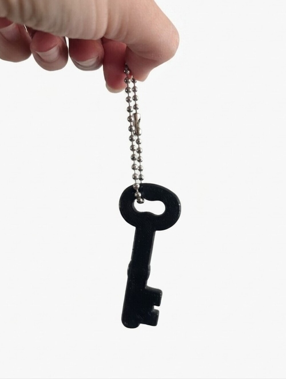 Fossil Handbag Key Charm – Black Acrylic Skeleton Key Accessory